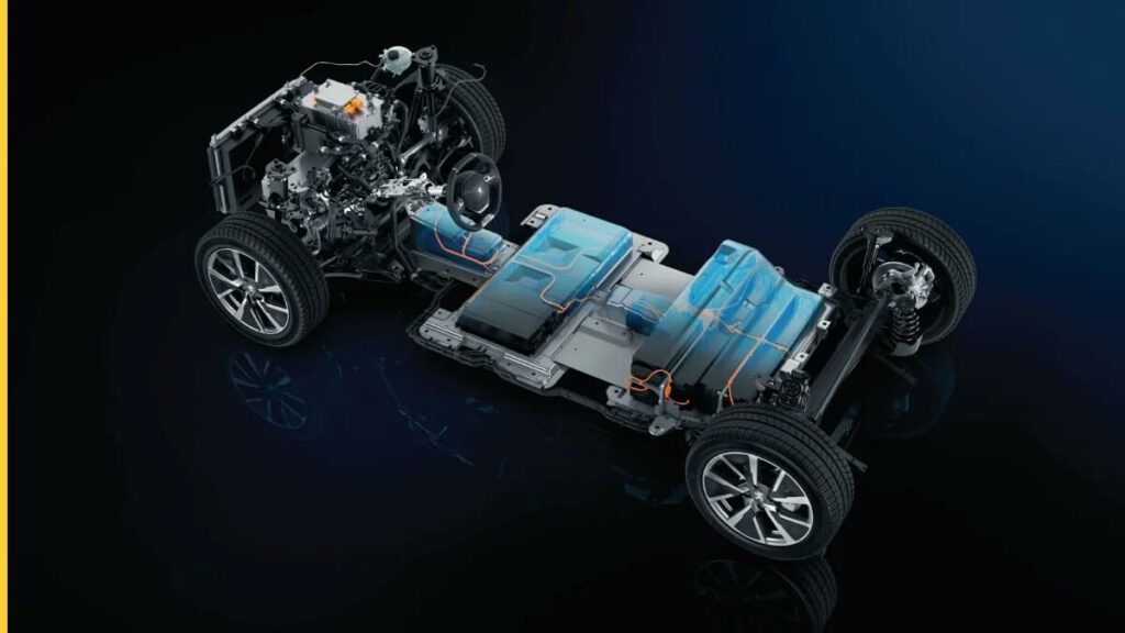Foto do motor do e-208 2023, a foto mostra toda a estrutura elétrica