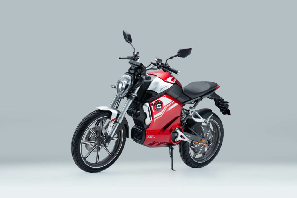 Moto vermelha (TSX) de lado.