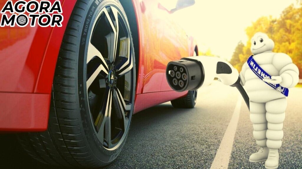 Foto de um pneu de carro elétrico e do boneco da Michelin