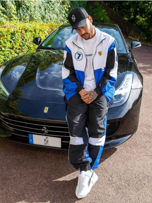 Neymar na frente de um carro.