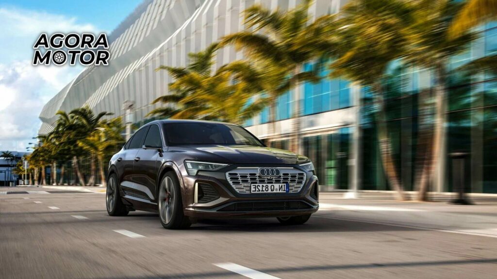 Foto frontal de um Audi Q8 e-tron Sportback na estrada