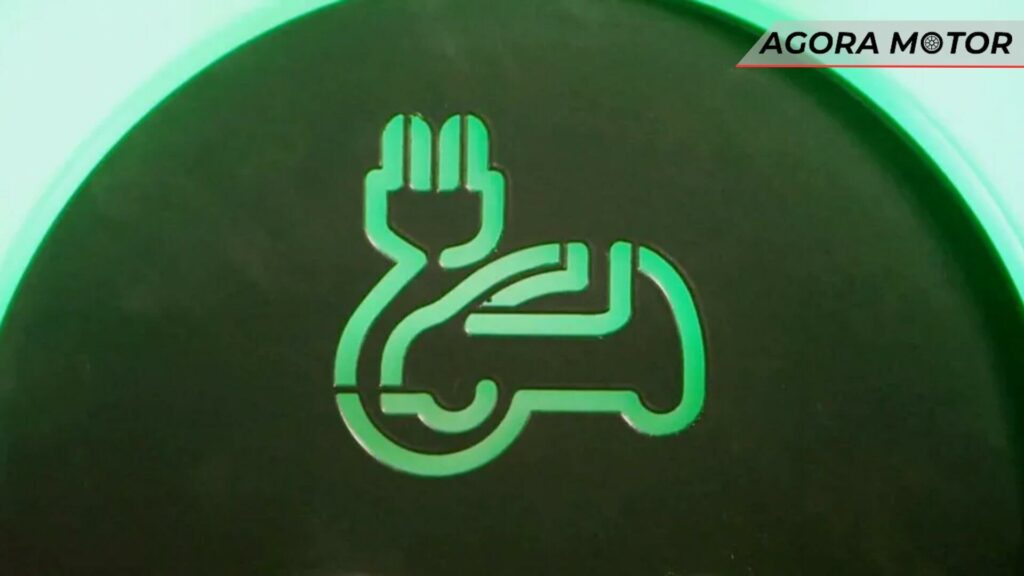 Foto de um carro com cabo de carregamento, carros eletrificados