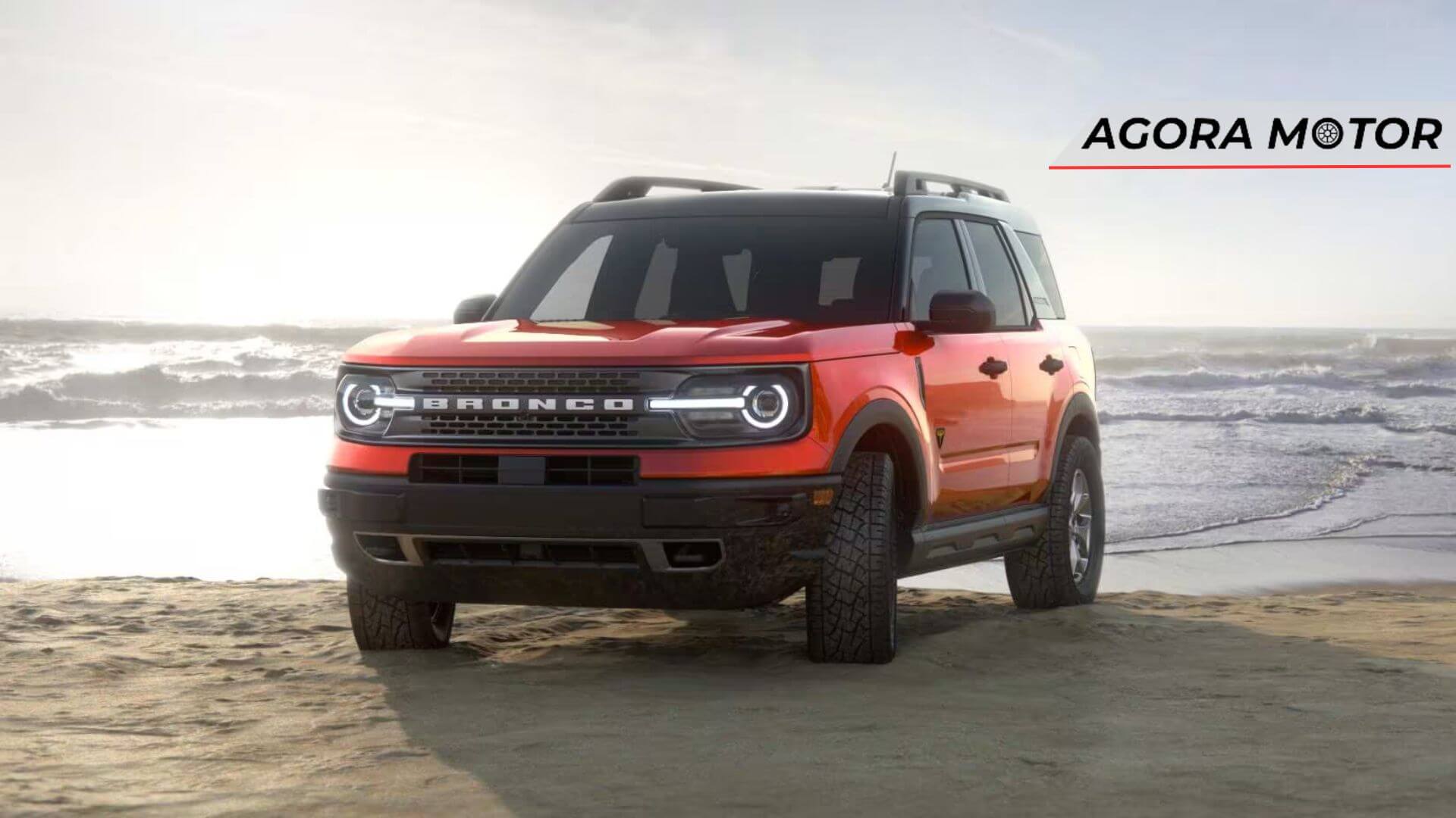 Foto de um Bronco 2024 laranja na praia