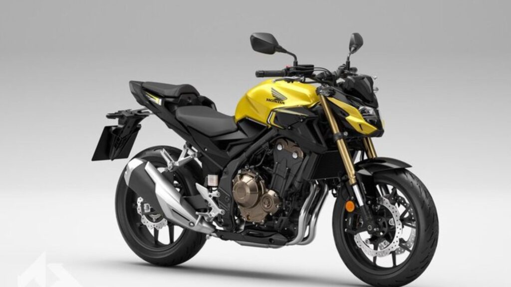 Honda CB 500F 2025 amarela em fundo branco.