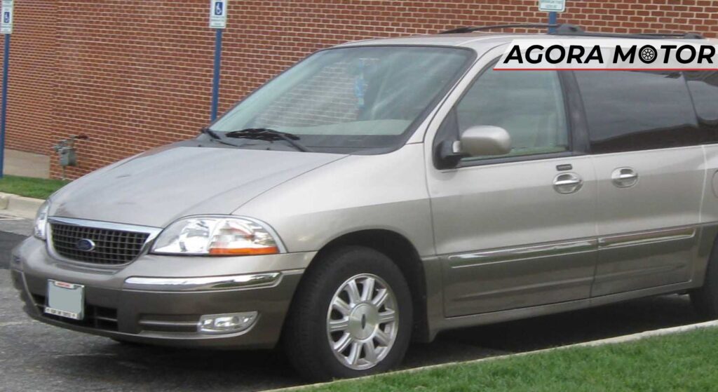 Ford Windstar prata de lado.