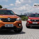 Fiat Mobi e o Renault Kwid parados na diagonal.