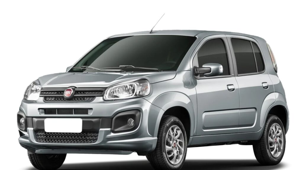 Fiat Uno cinza na diagonal no fundo branco.