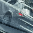 SUV do Onix camuflado andando na estrada.