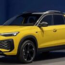 Nova picape da Volkswagen amarela parada na diagonal.